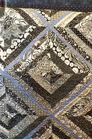 baby blue, white, and black quilt