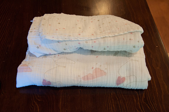 white/pink/grey muslin blankets/wraps